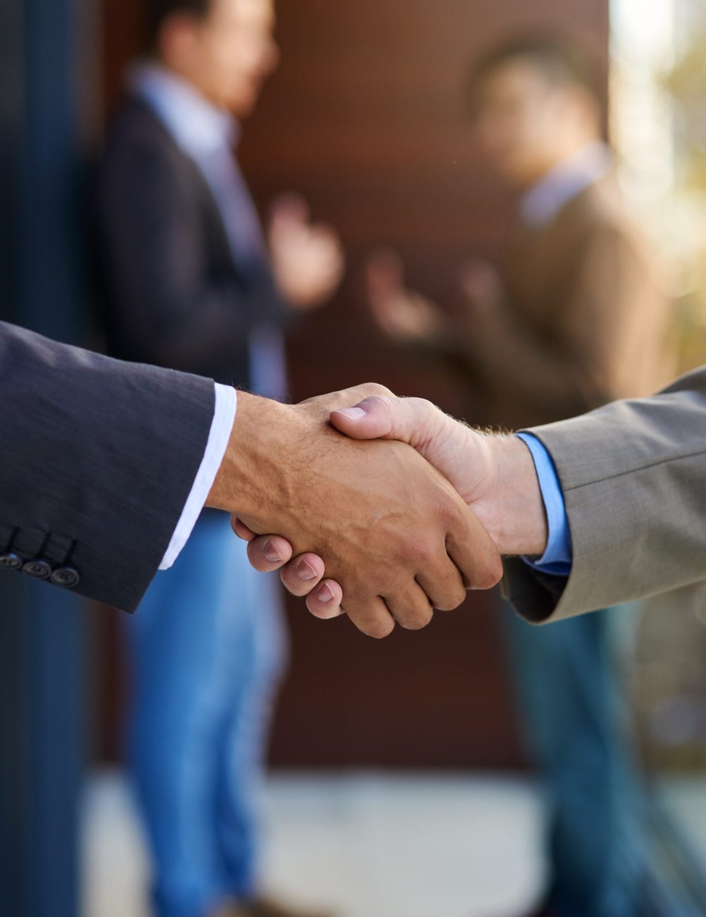 Business agreements. Shot of two businesspeople shaking hands